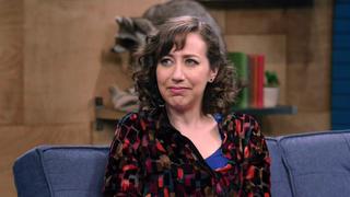 Kristen Schaal Wears Strawberry Colored Pants and a Multicolored Shirt