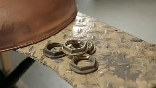 Peaked Caps; Custom Water Heaters; Electric Boats; Fencing Foils