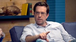 Ed Helms Wears a Grey Shirt & Brown Boots